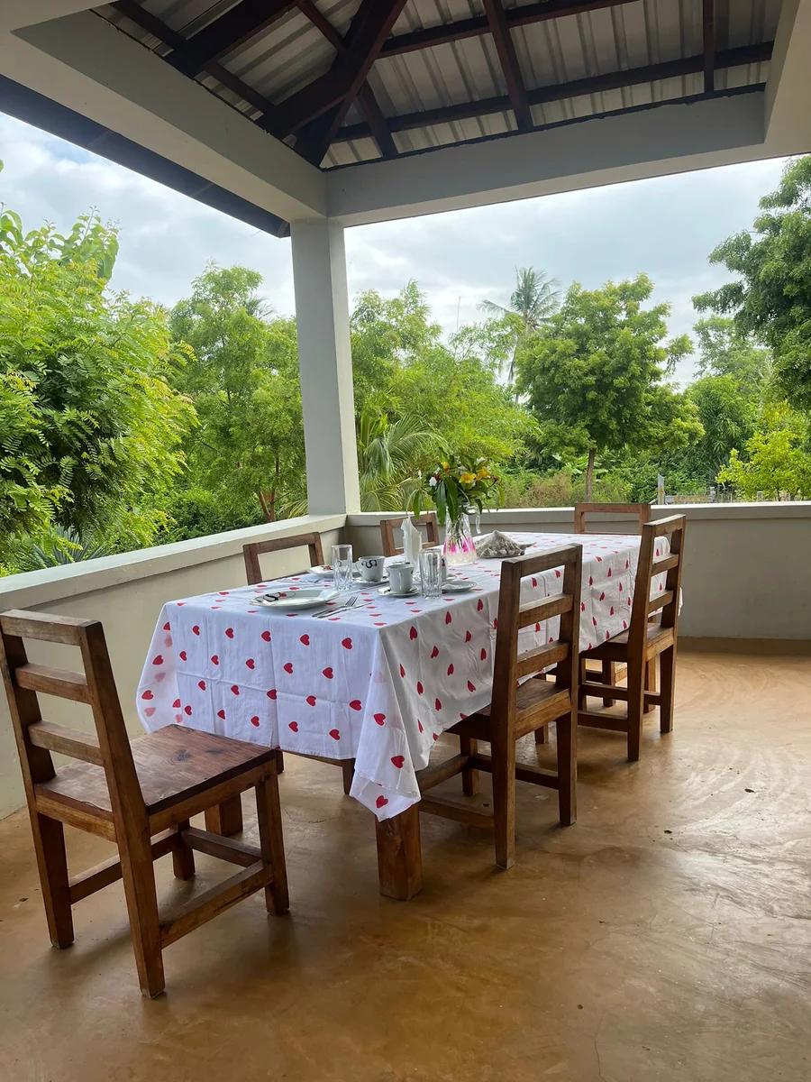 Veranda dining table set with a garden view