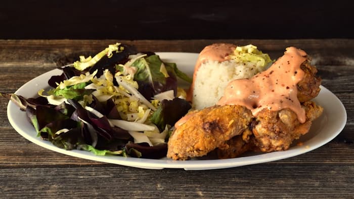 Local chicken plate with rice and salad