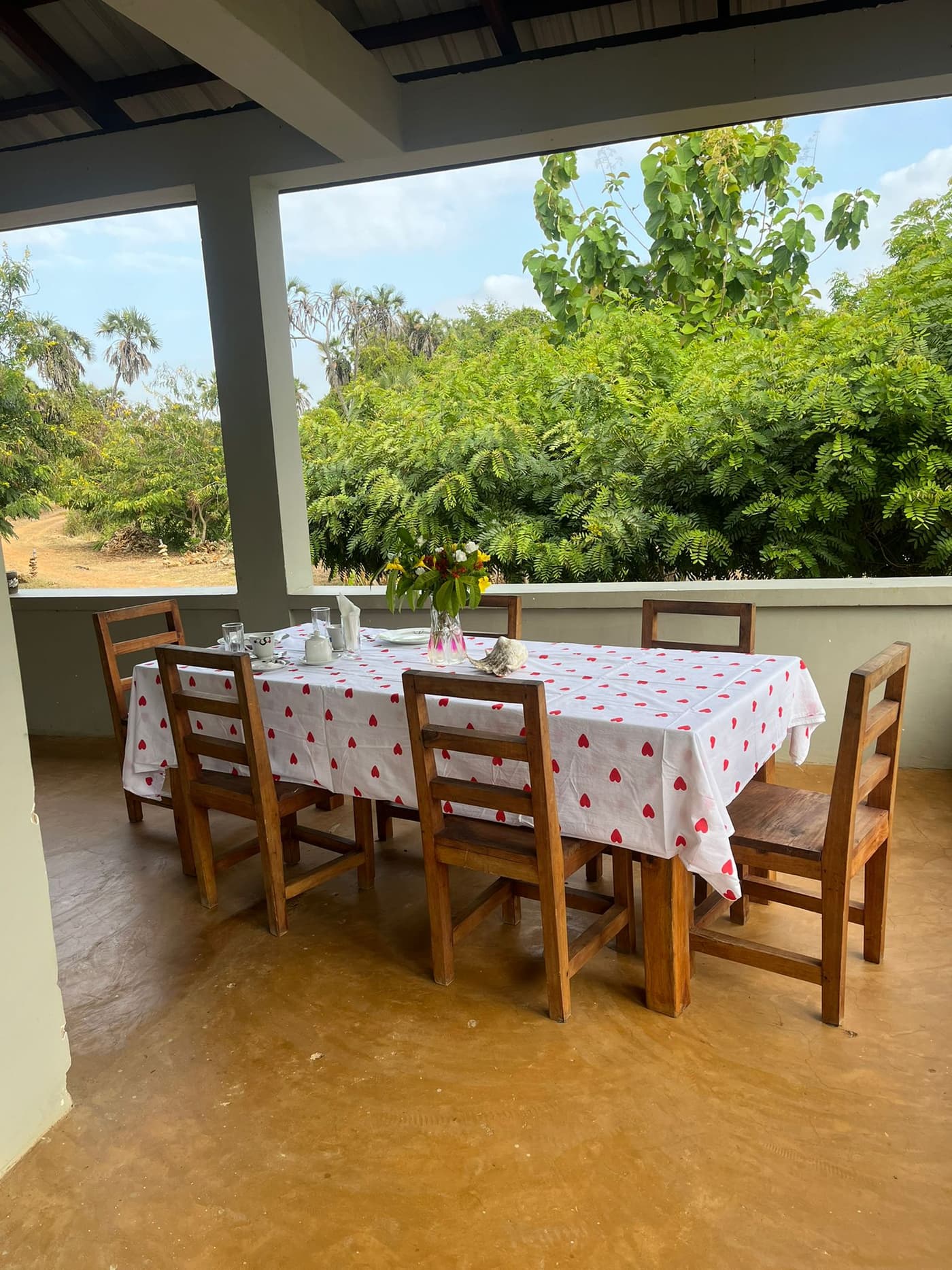 Outdoor dining veranda with garden view